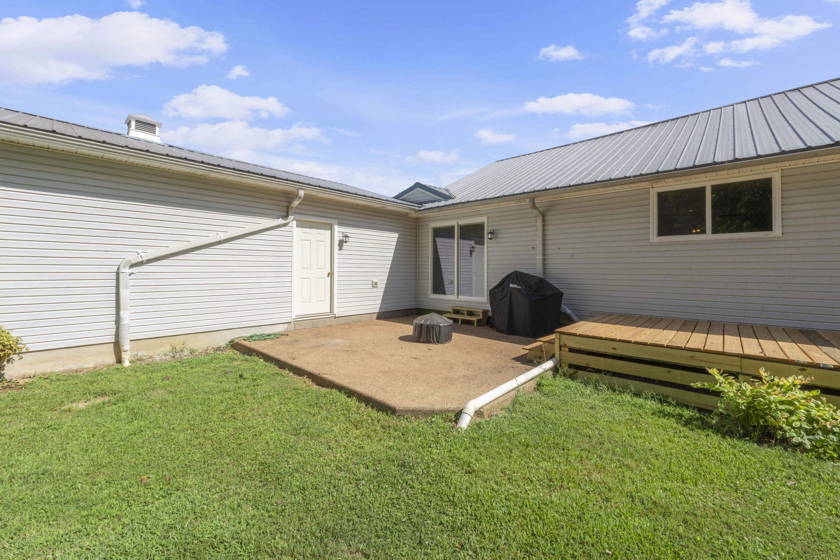849 Belton Road Ripley, TN 38063 - Photo 34 of 40 a backyard of a house with seating space