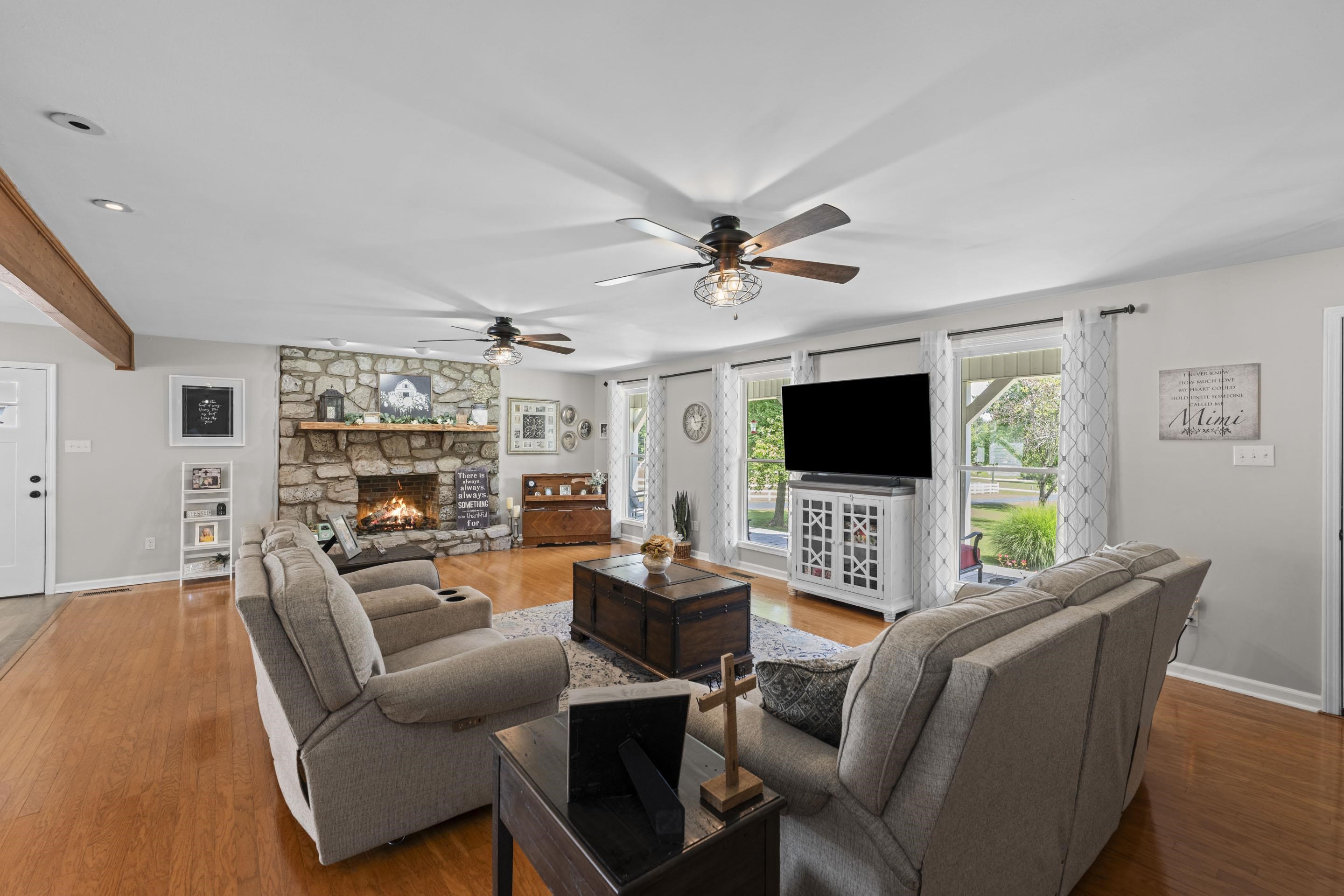 849 Belton Road Ripley, TN 38063 - Photo 6 of 40 a living room with furniture a flat screen tv and a fireplace
