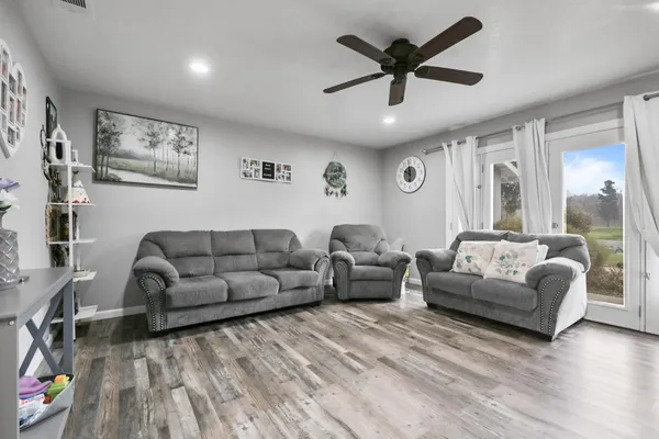 a living room with furniture and a large window