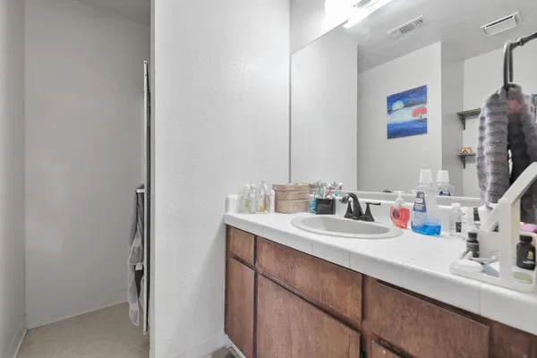 a bathroom with a sink and a mirror