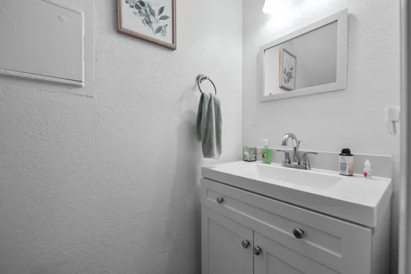 a bathroom with a sink and a mirror