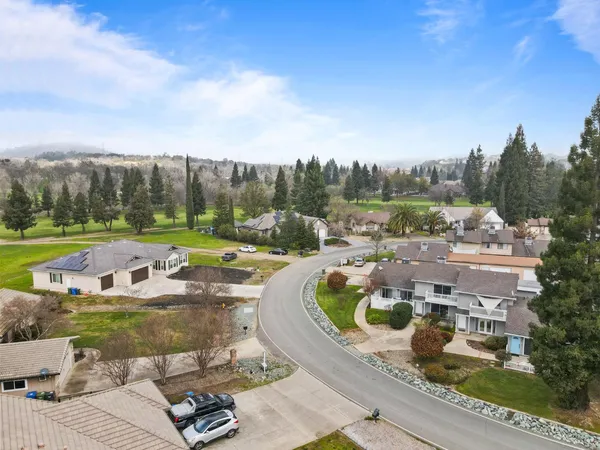 a view of a swimming pool with a yard