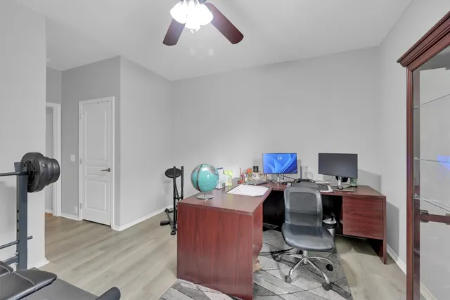 a workspace with furniture and wooden floor