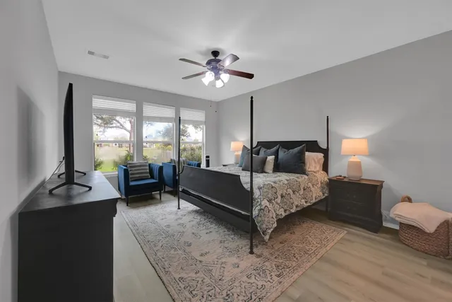 a bedroom with a bed and furniture