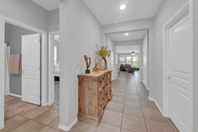 a view of a hallway with dining area