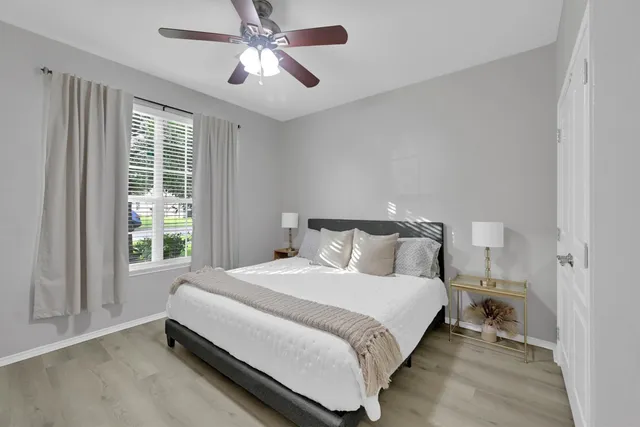 a bedroom with a bed and a window