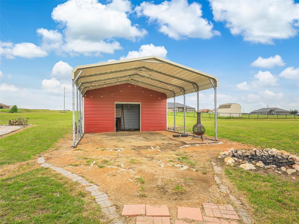 132 County Road 4213 Decatur, TX 76234 - Photo 19 of 27 a front view of a house with a yard