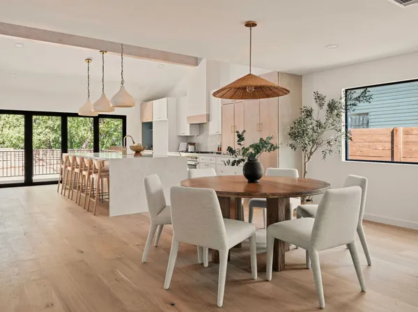 a view of a dining room with furniture window and outside view