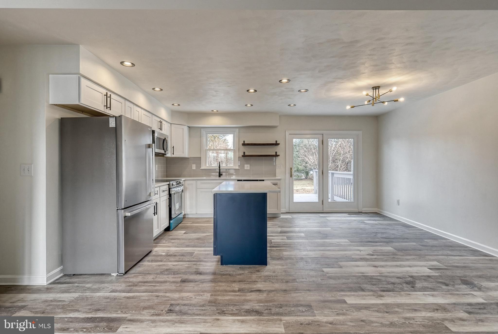 79 North School House Road Thomasville, PA 17364 - Photo 14 of 73 a kitchen with refrigerator cabinets and wooden floor