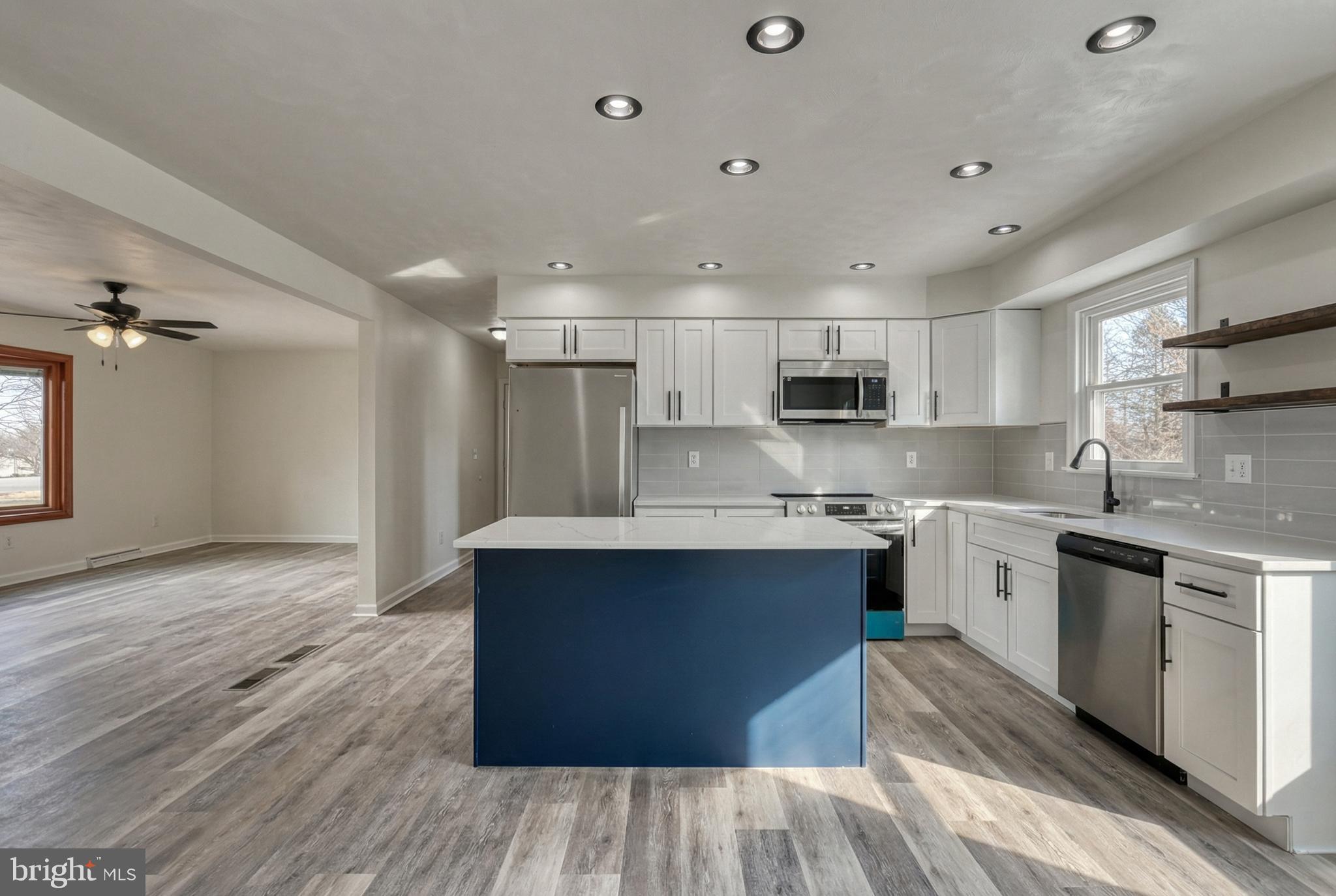 79 North School House Road Thomasville, PA 17364 - Photo 18 of 73 a kitchen with stainless steel appliances granite countertop a sink stove and refrigerator
