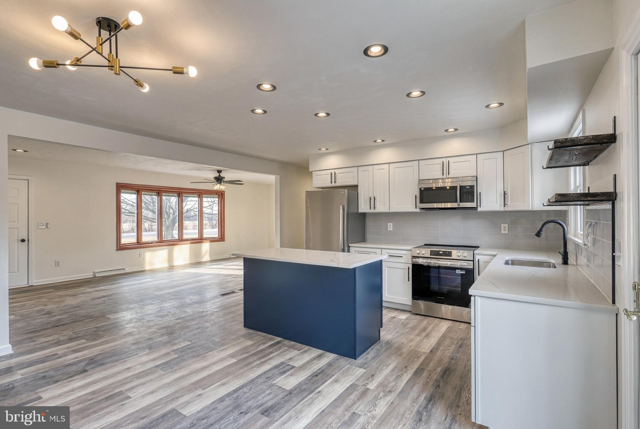 79 North School House Road Thomasville, PA 17364 - Photo 22 of 73 a large kitchen with stainless steel appliances granite countertop a stove a sink dishwasher and a refrigerator