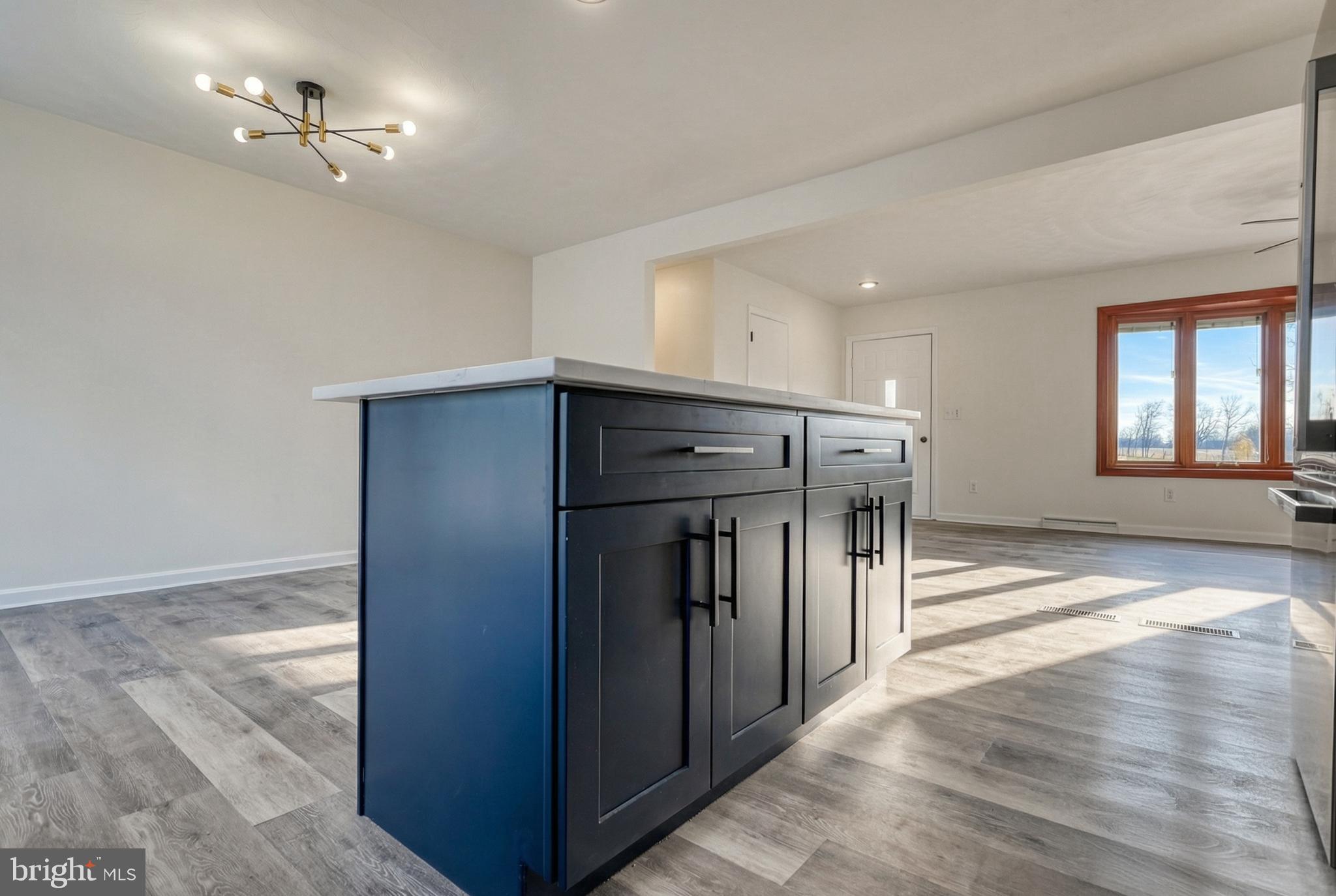 79 North School House Road Thomasville, PA 17364 - Photo 24 of 73 a view of a hallway to a bedroom with wooden floor and a ceiling fan