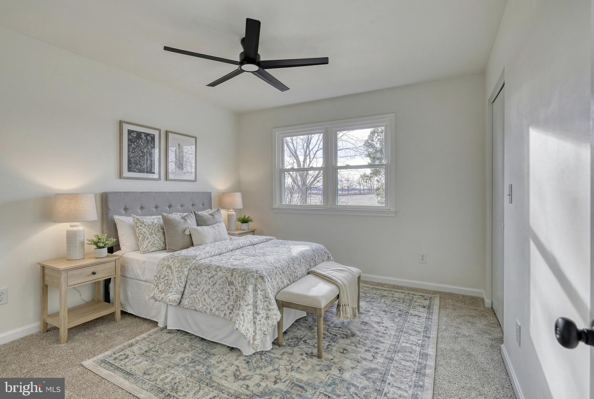 79 North School House Road Thomasville, PA 17364 - Photo 29 of 73 a bedroom with a large bed and a window