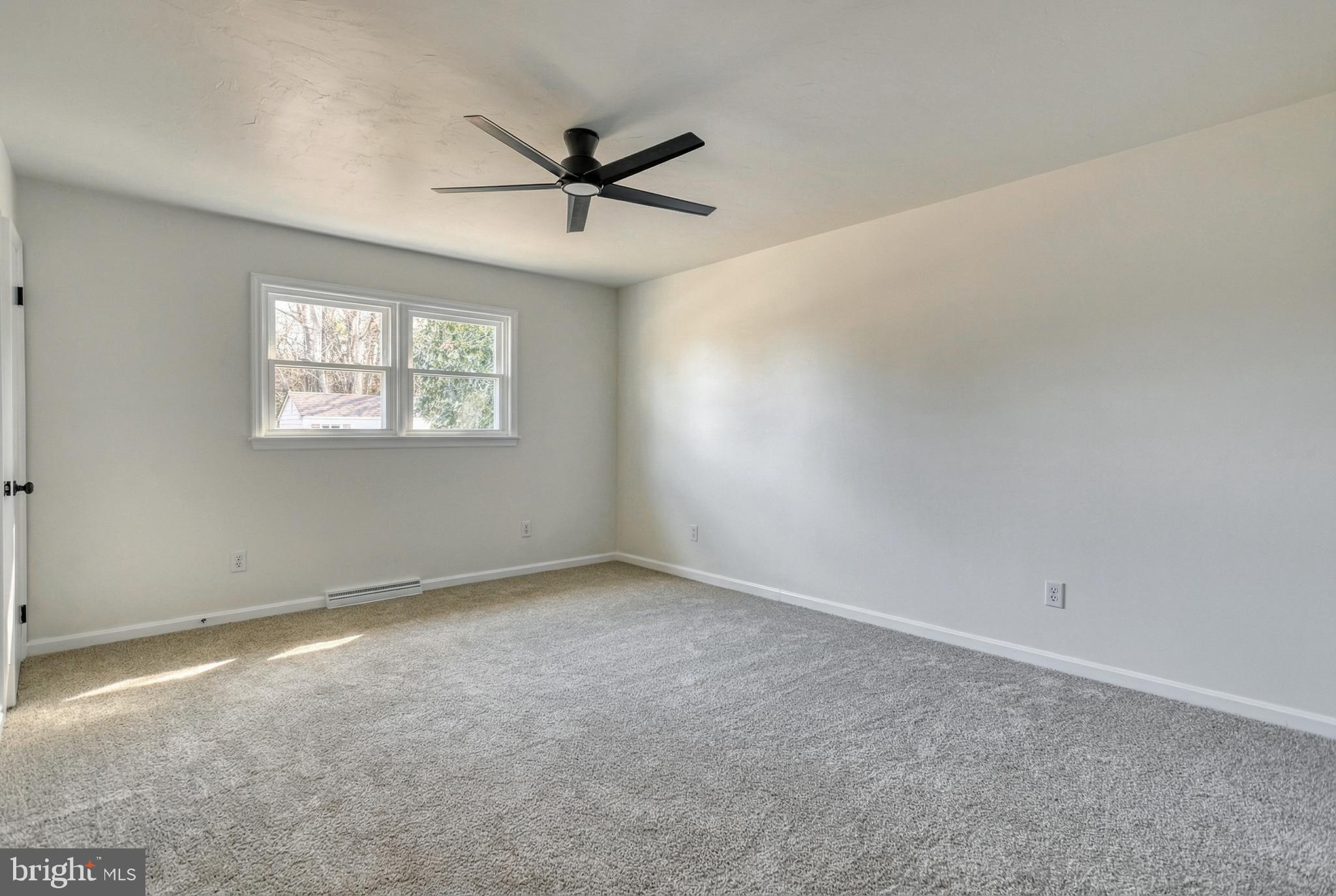 79 North School House Road Thomasville, PA 17364 - Photo 33 of 73 an empty room with a window and a fan