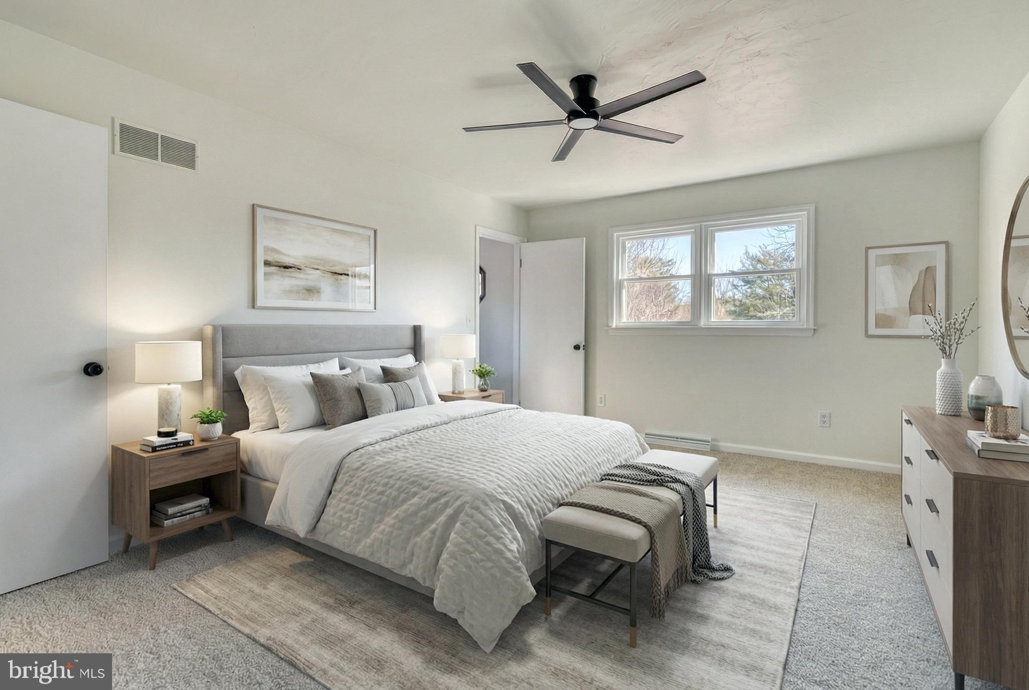 79 North School House Road Thomasville, PA 17364 - Photo 36 of 73 a bedroom with a large bed and a chandelier