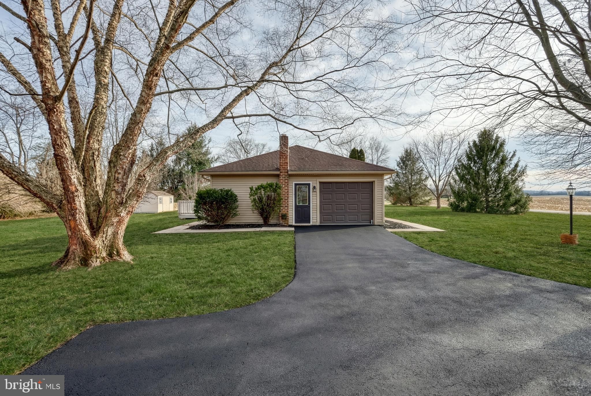 79 North School House Road Thomasville, PA 17364 - Photo 57 of 73 a front view of a house with a garden