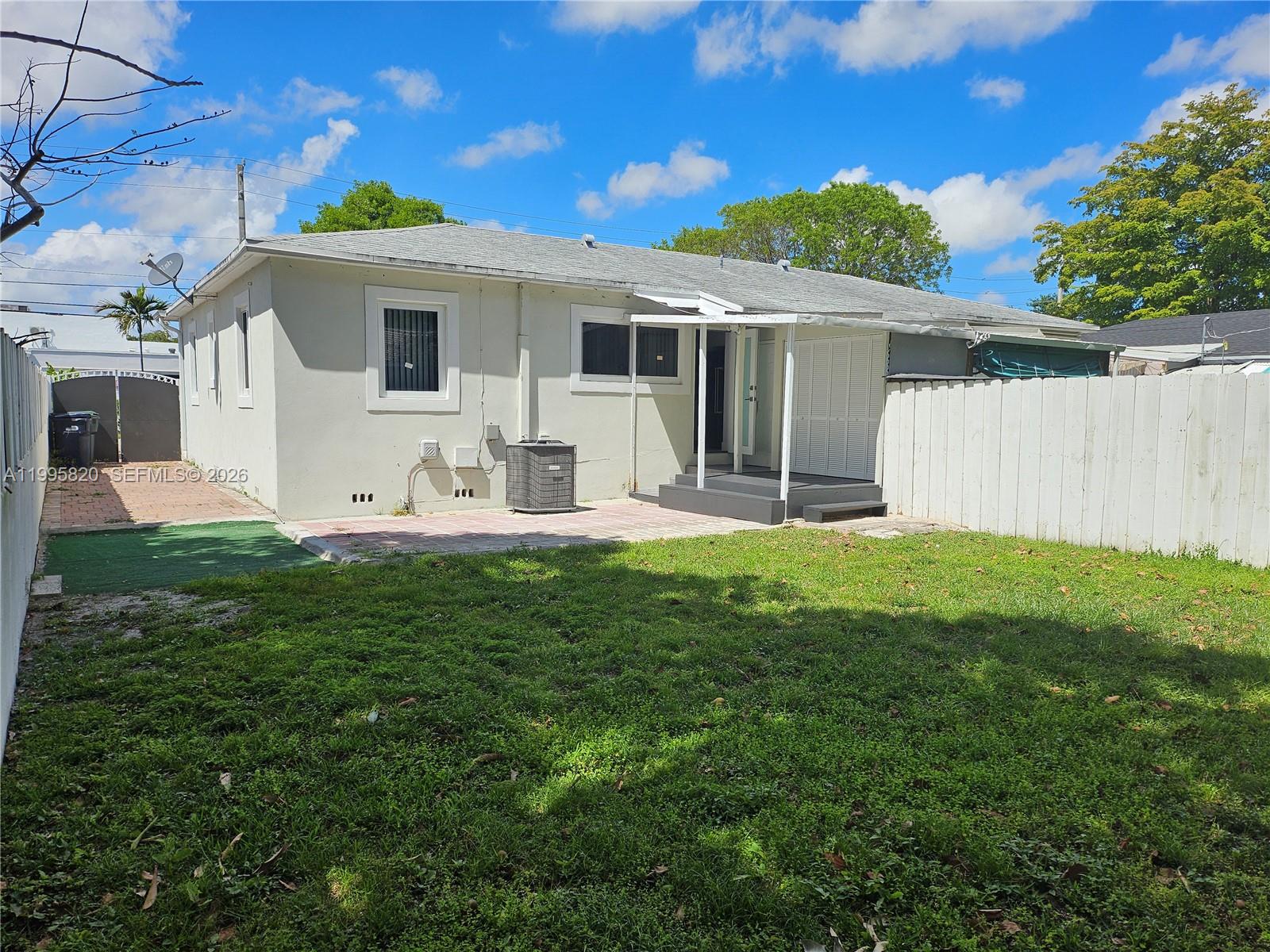 5816 Southwest 9th Street West Miami, FL 33144 - Photo 12 of 12 a view of a house with a yard porch and sitting area