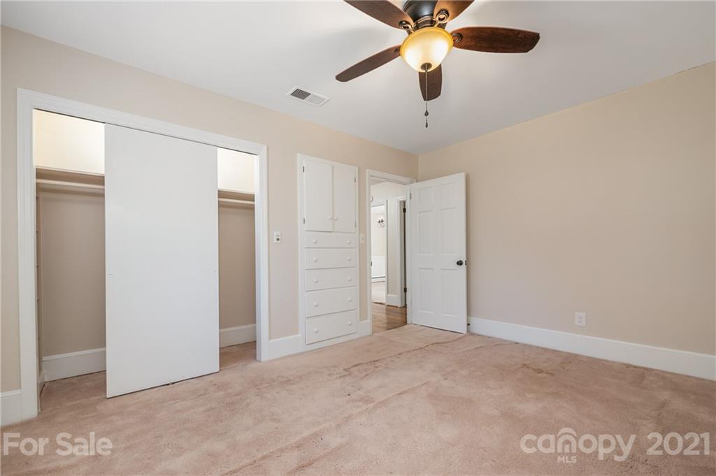 285 Tanner Street Rutherfordton, NC 28139 - Photo 15 of 39 an empty room with closet and a chandelier fan