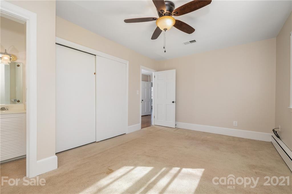 285 Tanner Street Rutherfordton, NC 28139 - Photo 16 of 39 an empty room with closet and a chandelier fan