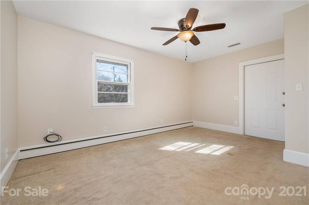 285 Tanner Street Rutherfordton, NC 28139 - Photo 18 of 39 a view of room with ceiling fan and window