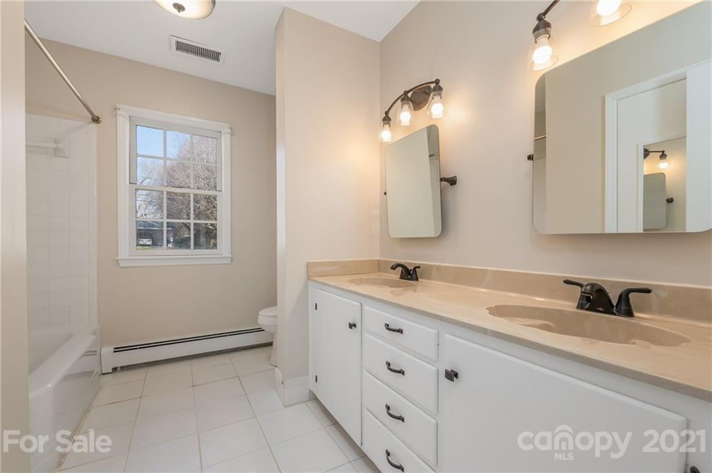 285 Tanner Street Rutherfordton, NC 28139 - Photo 19 of 39 a bathroom with a sink and a mirror