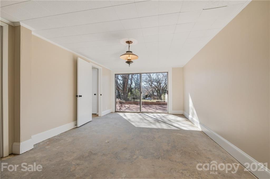 285 Tanner Street Rutherfordton, NC 28139 - Photo 21 of 39 a view of empty room with wooden floor and fan