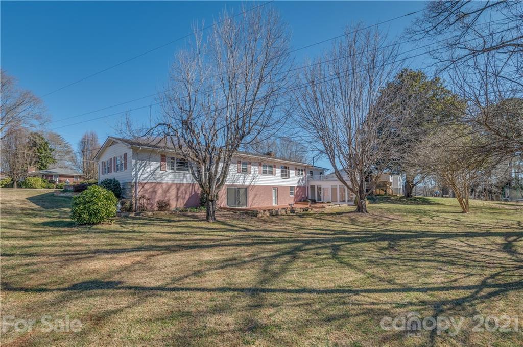 285 Tanner Street Rutherfordton, NC 28139 - Photo 4 of 39 a view of big yard next to a house