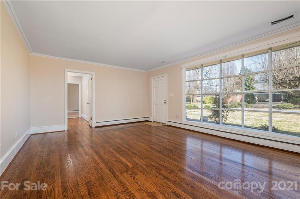 285 Tanner Street Rutherfordton, NC 28139 - Photo 6 of 39 wooden floor in an empty room with a window