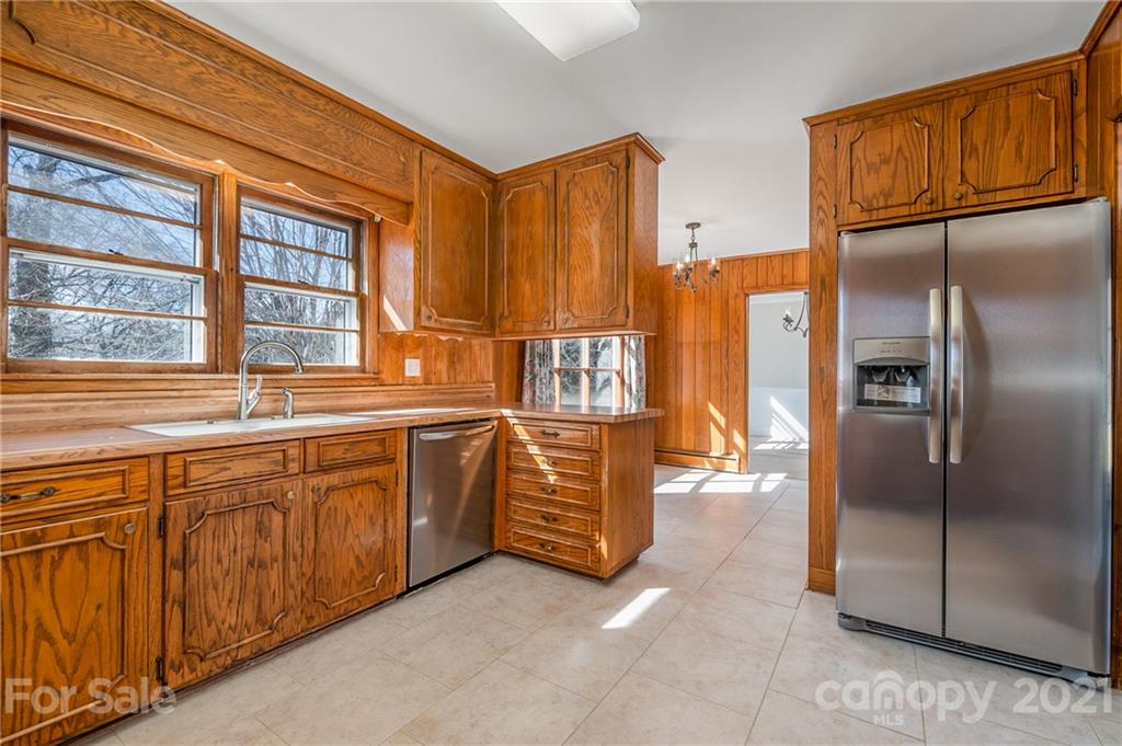 285 Tanner Street Rutherfordton, NC 28139 - Photo 7 of 39 a kitchen with stainless steel appliances granite countertop a refrigerator and a sink