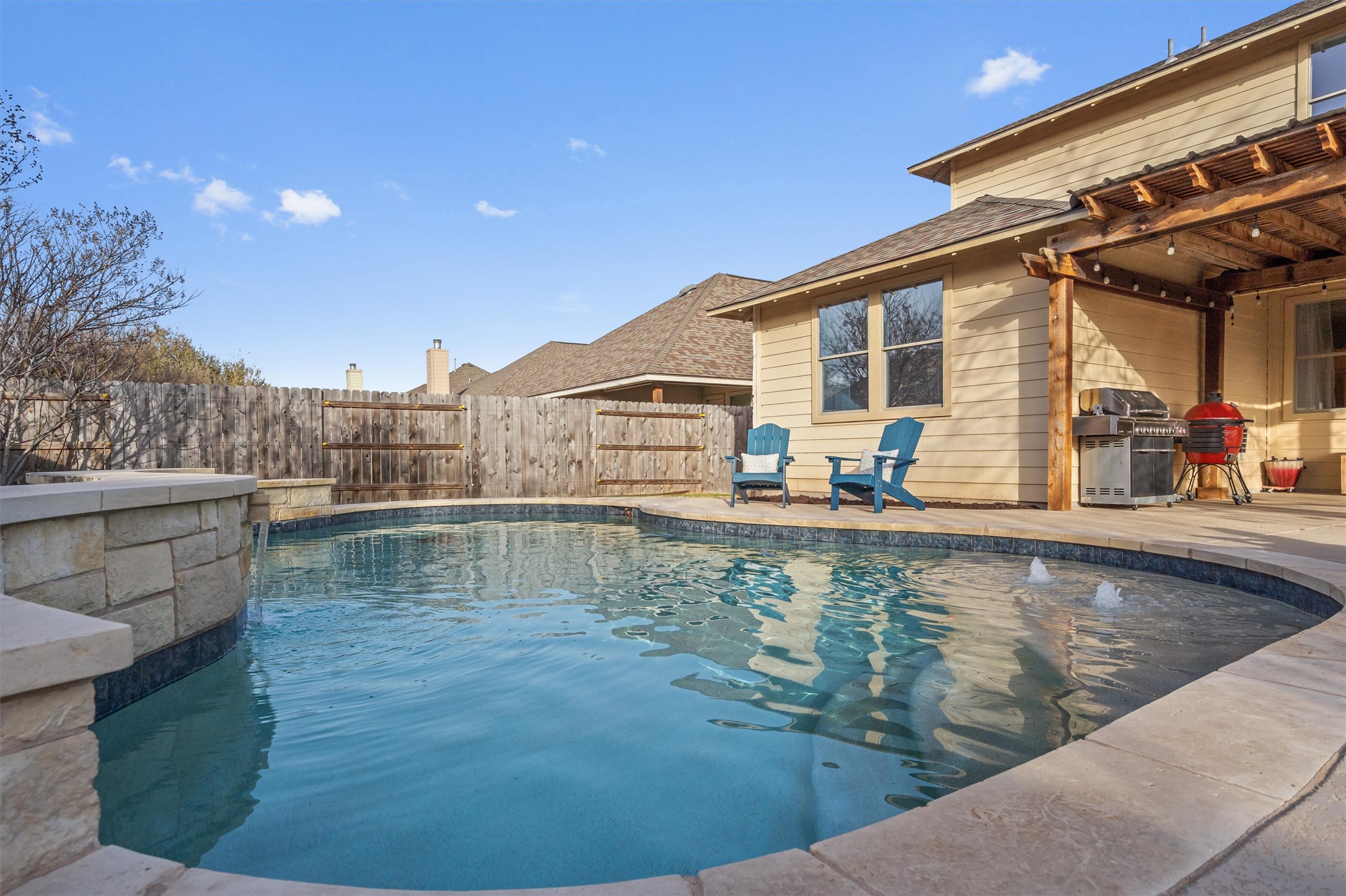 407 Tascate Street Georgetown, TX 78628 - Photo 1 of 1 Check out the pool fountain! Outdoor extended patio with pool and pergola. Perfect for hosting gatherings.
