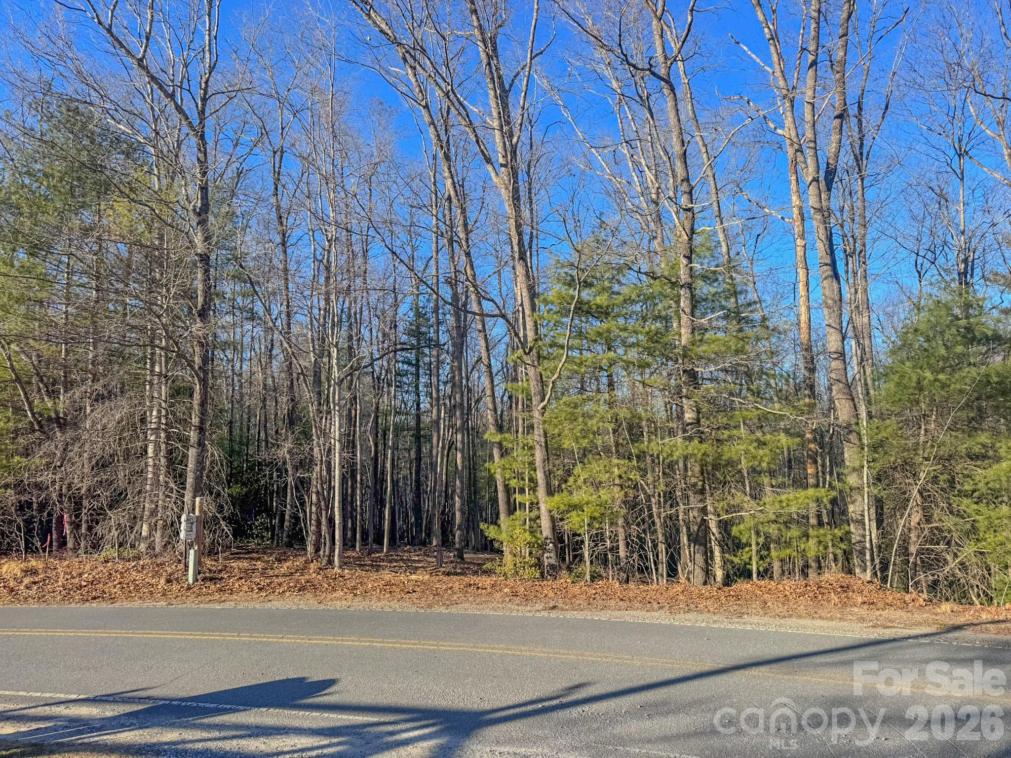 0 Old CCC Road, Unit 3 Hendersonville, NC 28739 - Photo 8 of 43 a view of a brick building next to a yard