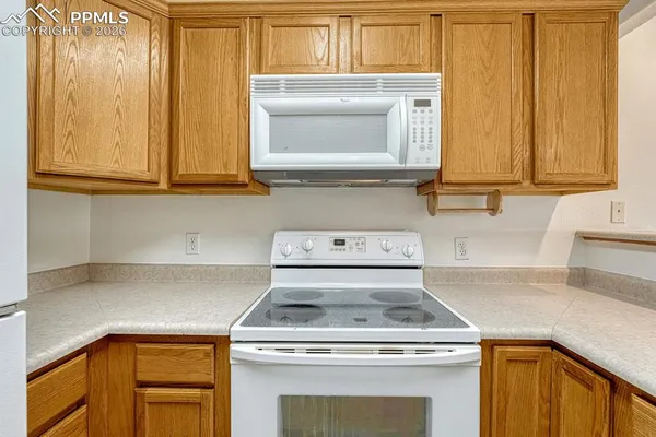 a kitchen with a stove and a microwave