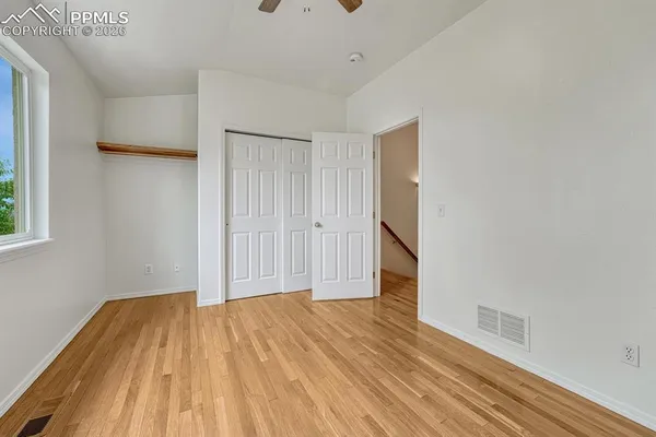 a view of a room with wooden floor and small space