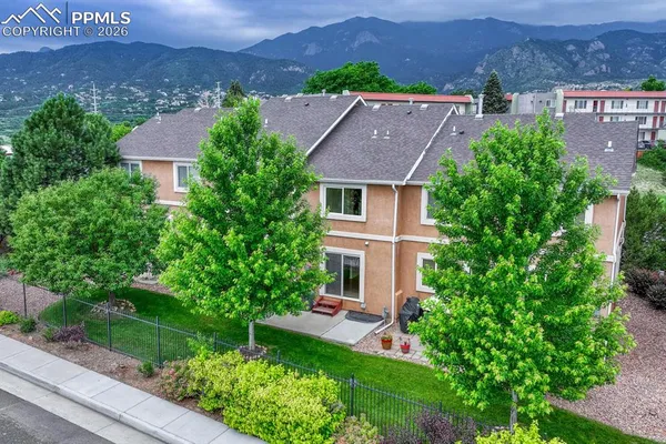 an aerial view of a house with a garden