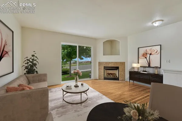 a living room with furniture and a fireplace