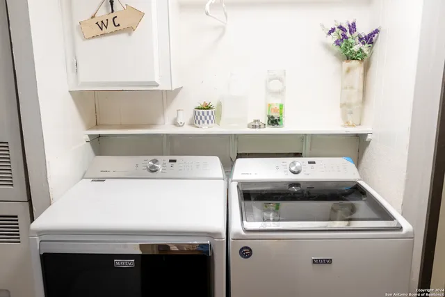 a utility room with dryer and washer