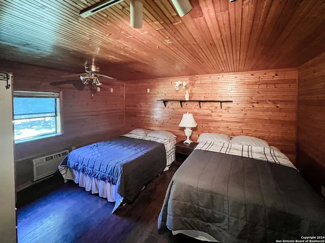 a bedroom with bed and a window