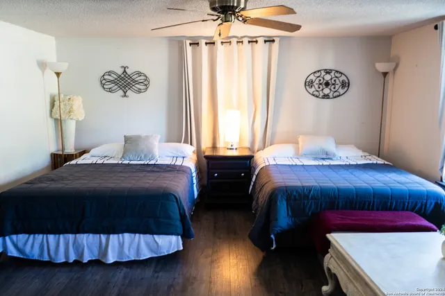 a bedroom with double bed and a window