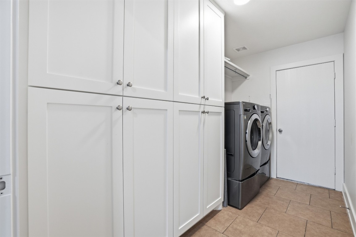 1631 Hade Meadow Lane Houston, TX 77073 - Photo 35 of 36 Laundry room with plenty of more storage place. Washer/dryer included