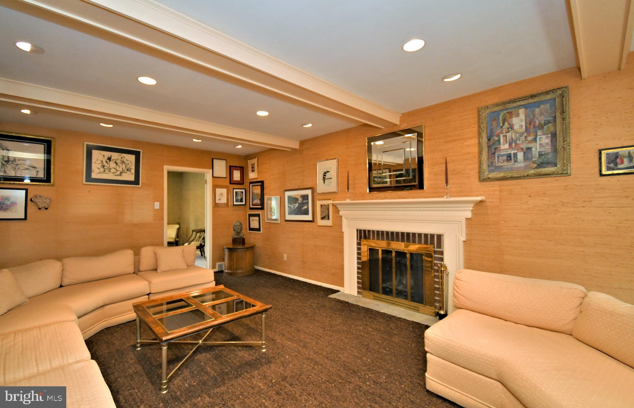 1658 Cavan Drive Dresher, PA 19025 - Photo 3 of 25 a living room with furniture a fireplace and a flat screen tv