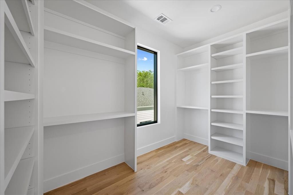 4517 Weldon Street Dallas, TX 75204 - Photo 27 of 40 a view of an empty room with a window and wooden floor