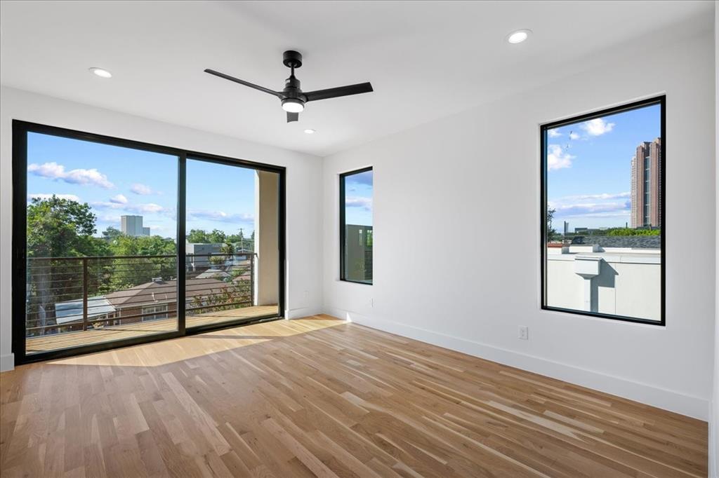 4517 Weldon Street Dallas, TX 75204 - Photo 28 of 40 a view of empty room with wooden floor and fan