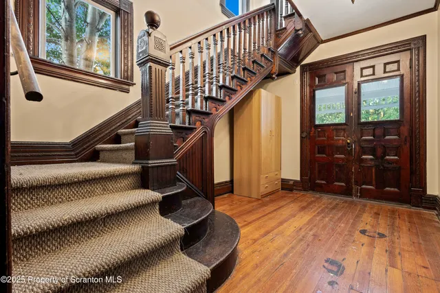 a view of an entryway with staircase