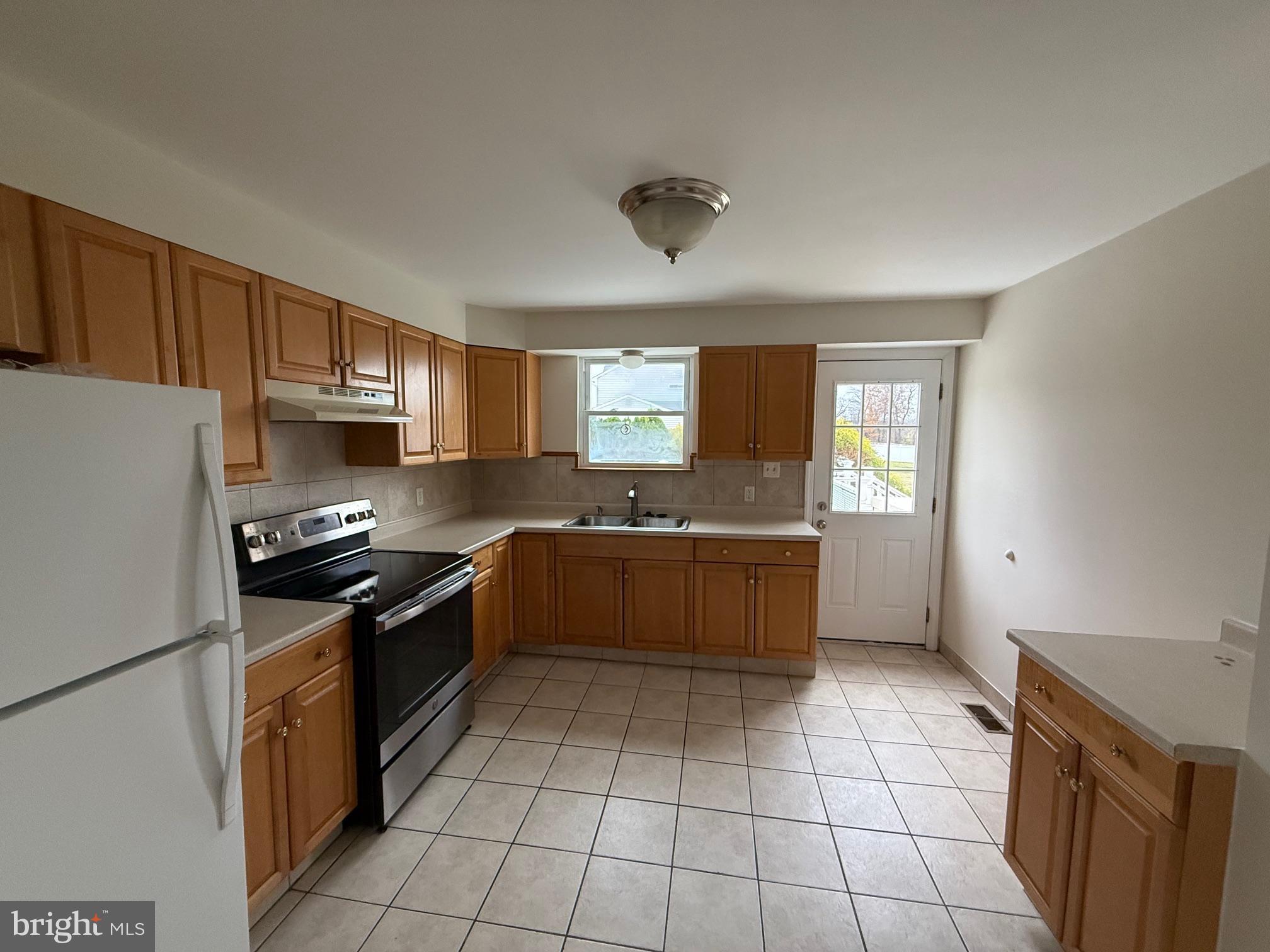 1100 Chews Landing Road Laurel Springs, NJ 08021 - Photo 15 of 33 a large kitchen with granite countertop a stove a sink dishwasher and a refrigerator