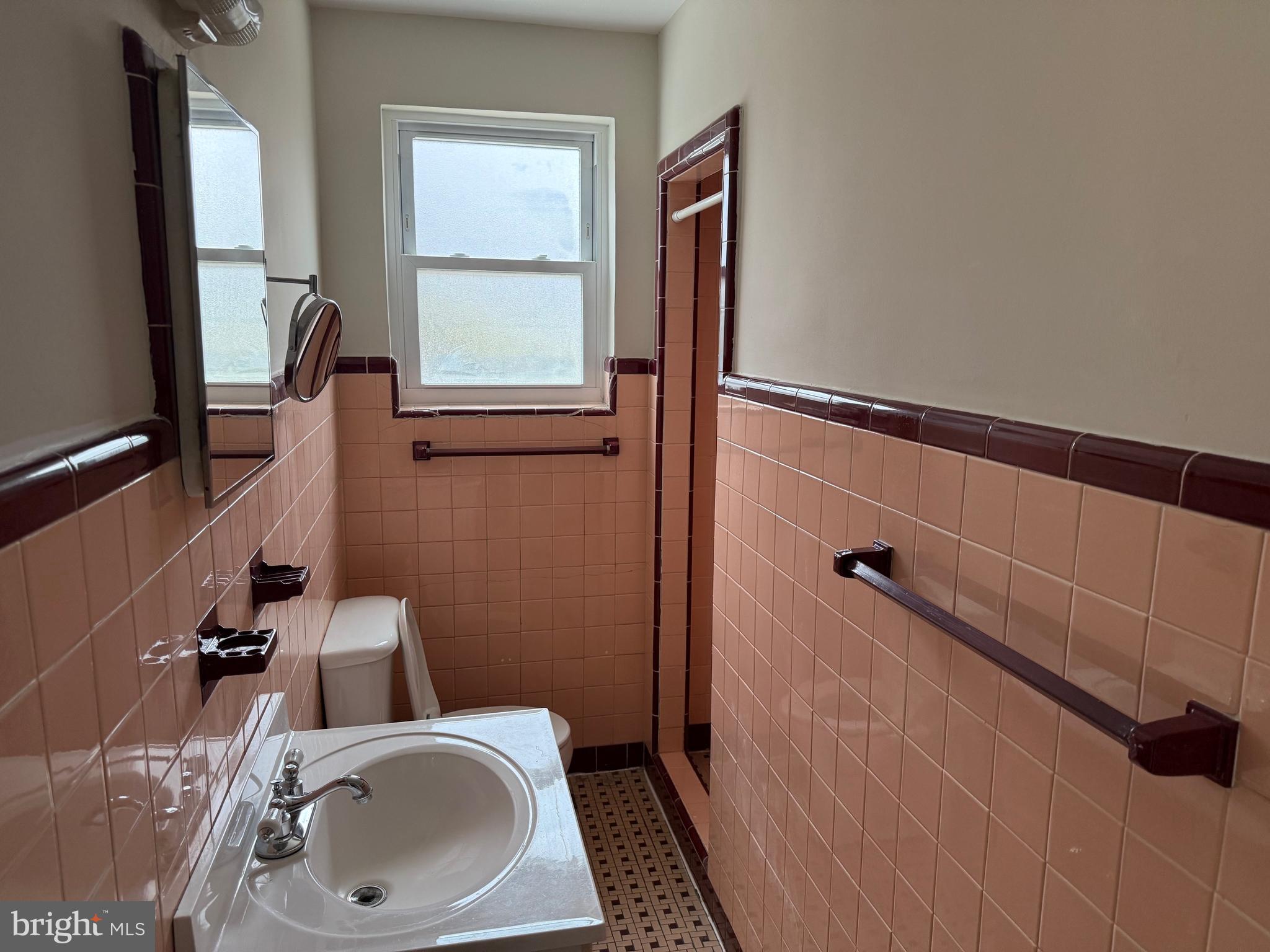 1100 Chews Landing Road Laurel Springs, NJ 08021 - Photo 17 of 33 a bathroom with a sink and mirror with toilet