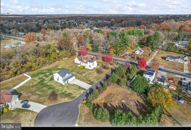 an aerial view of a house with a yard basket ball court and outdoor seating