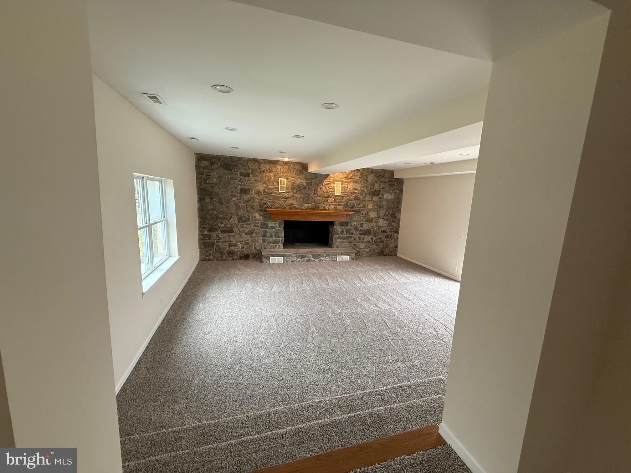 1100 Chews Landing Road Laurel Springs, NJ 08021 - Photo 10 of 33 a view of an empty room with a fireplace and a window