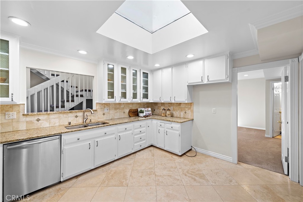 3044 Cresta Way Laguna Beach, CA 92651 - Photo 13 of 48 a kitchen with a sink window and cabinets