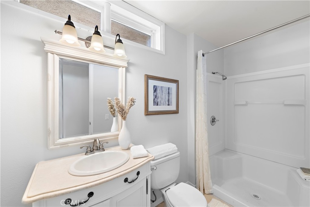 3044 Cresta Way Laguna Beach, CA 92651 - Photo 18 of 48 a bathroom with a sink toilet and shower