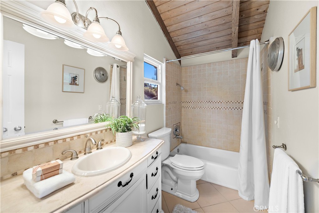 3044 Cresta Way Laguna Beach, CA 92651 - Photo 25 of 48 a bathroom with a sink a toilet and shower